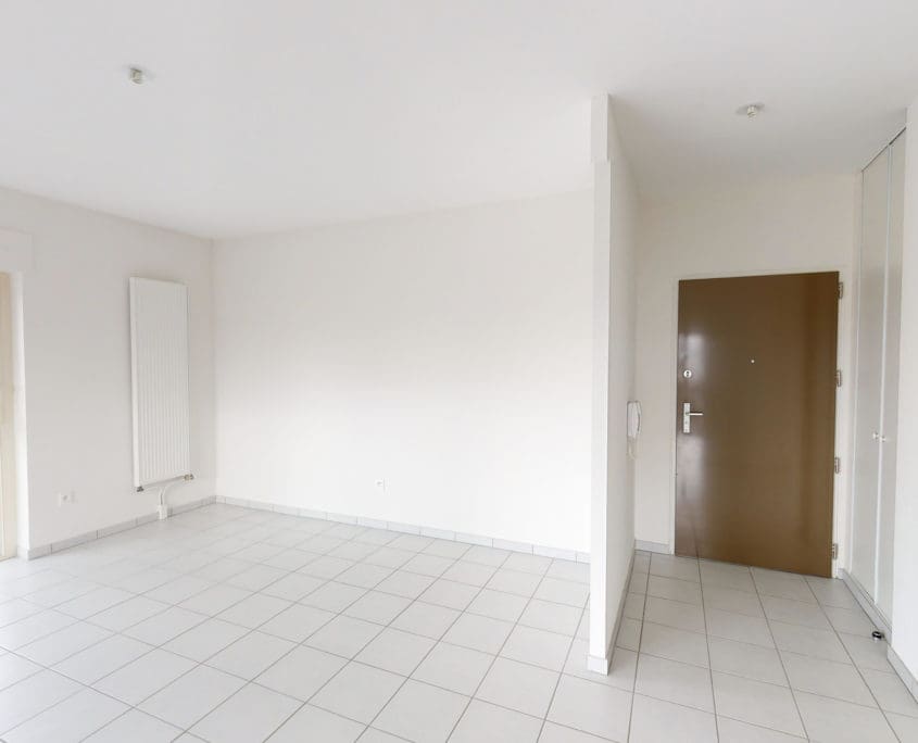 Photo salle de séjour et hall d'entrée T3 • Rés. Canopia