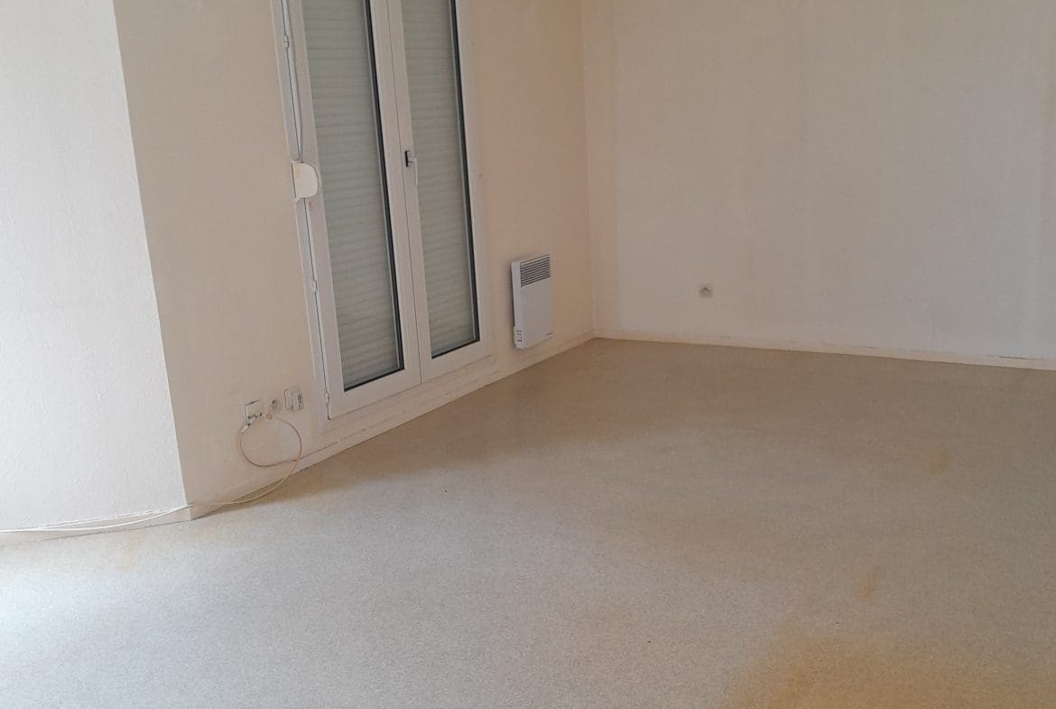 Photo salle de séjour T2 • quartier Allées du Chateau - Chevigny saint sauveur